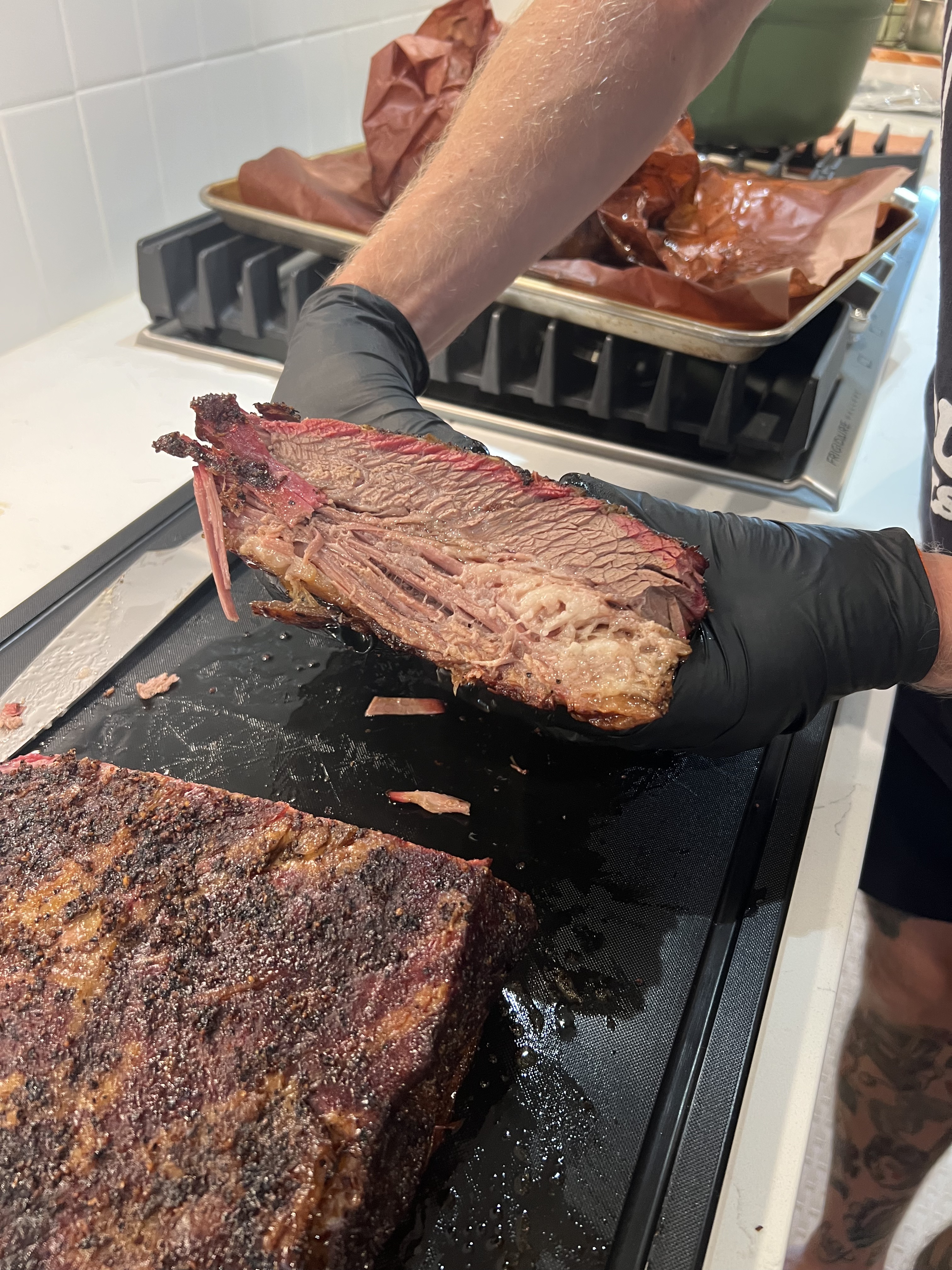 Sliced Brisket #2 showing the bark, smoke ring, and rendered fat